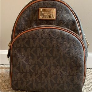 Michael Kors Brown Monogram Backpack.